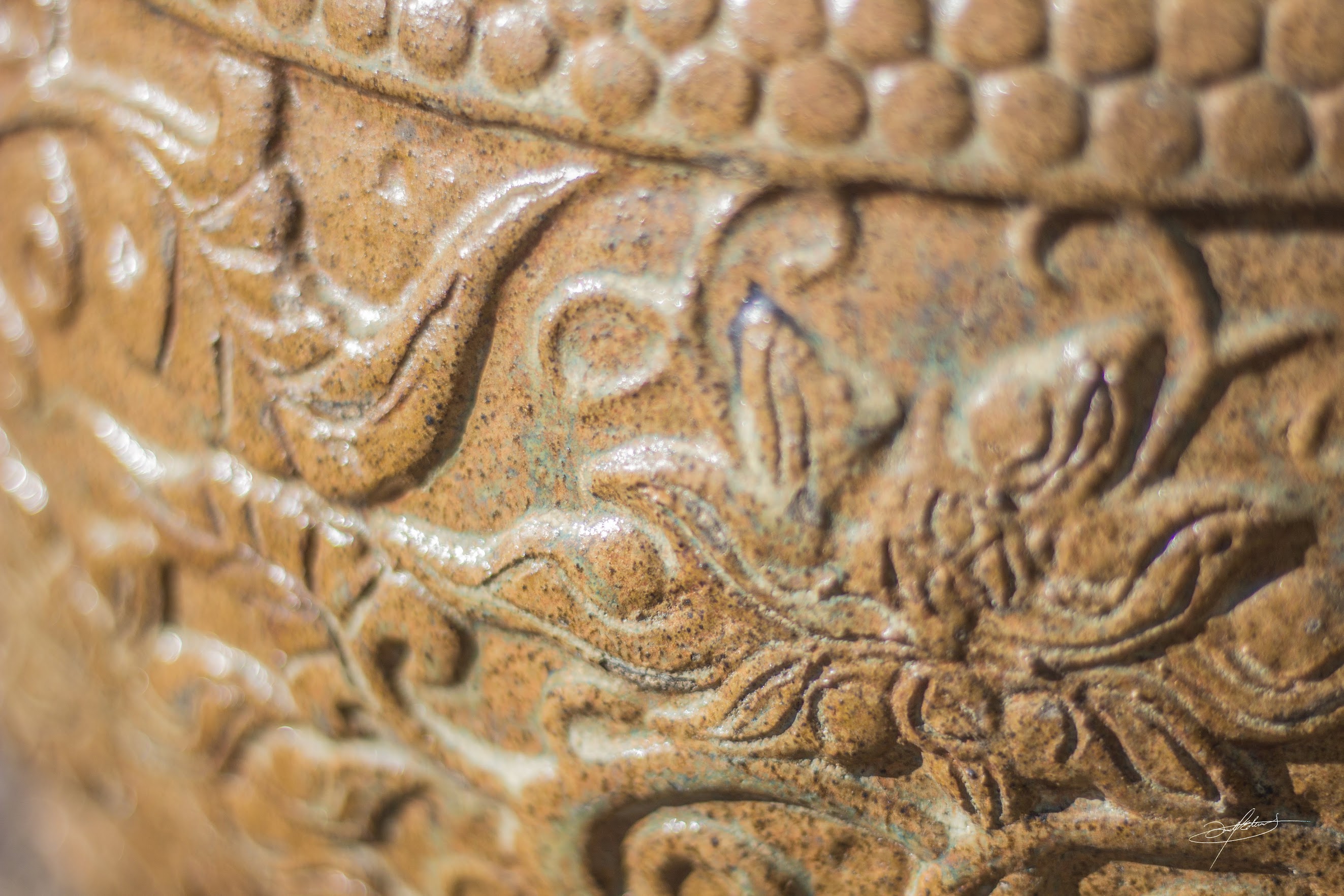 close up of intricate art on ceramic pottery at botanicals st george